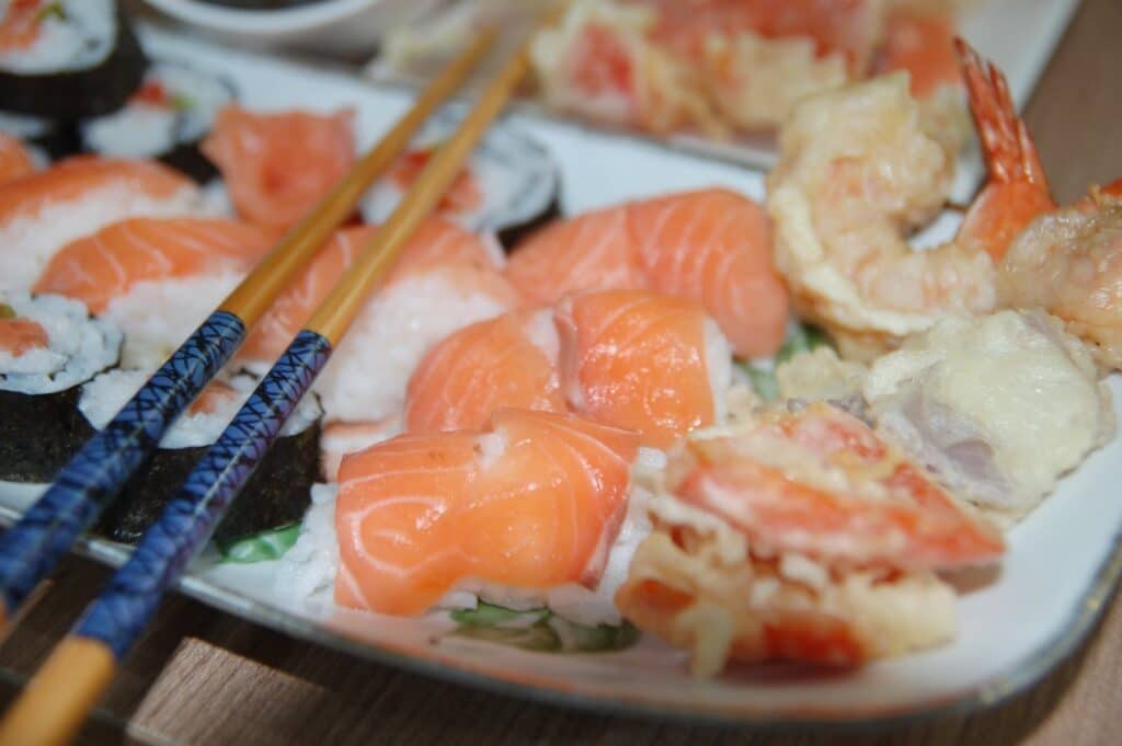 Chopsticks on Top of Variety of Sushi on Plate

Can dogs have tuna